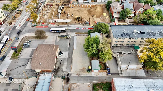an aerial view of multiple houses with outdoor space