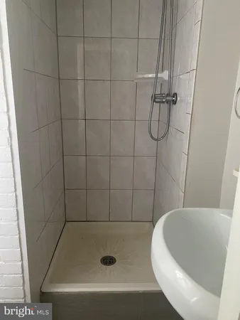 a bathroom with a tub and a shower
