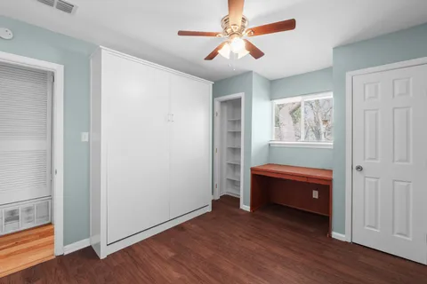 a room with furniture and wooden floor