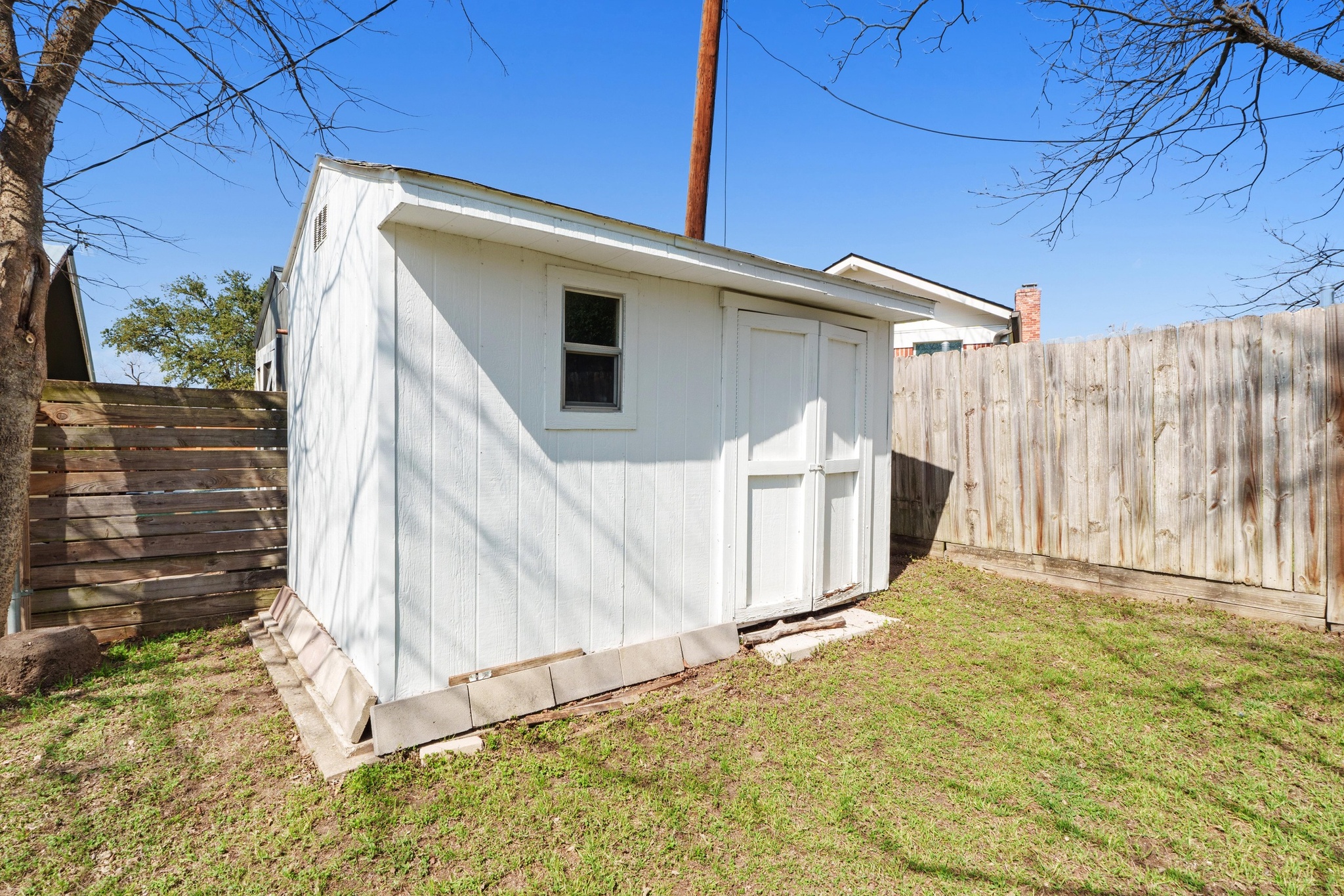 2312 Rogge Lane Austin, TX 78723 - Photo 32 of 34 View of shed with a fenced backyard.