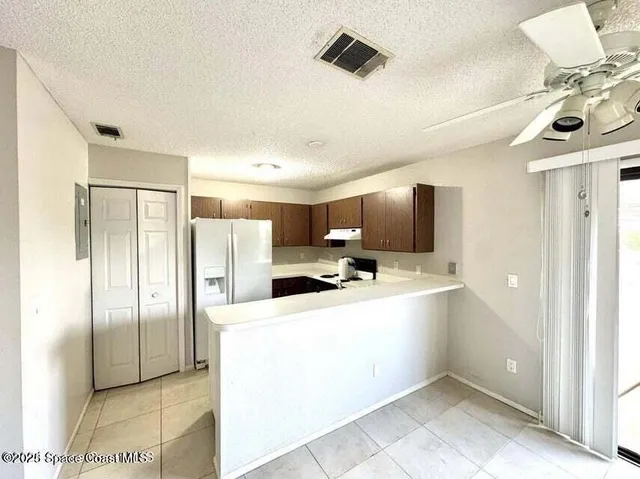 a kitchen with stainless steel appliances a refrigerator and a sink