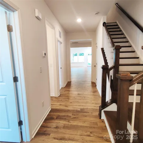 a view of entryway with wooden floor