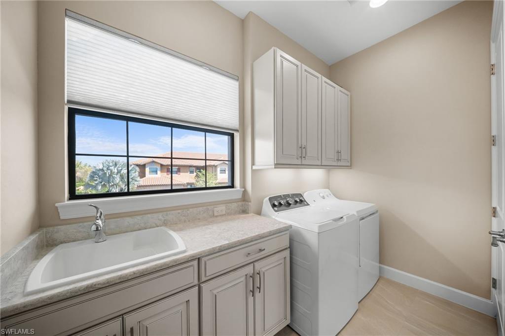 9672 Montelanico Loop, Unit 203 Naples, FL 34119 - Photo 24 of 49 a view of a sink and a window in a room