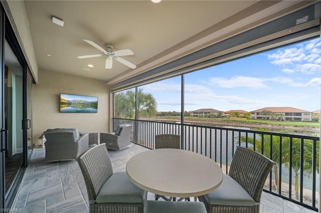 9672 Montelanico Loop, Unit 203 Naples, FL 34119 - Photo 26 of 49 a view of a dining room with furniture window and outside view