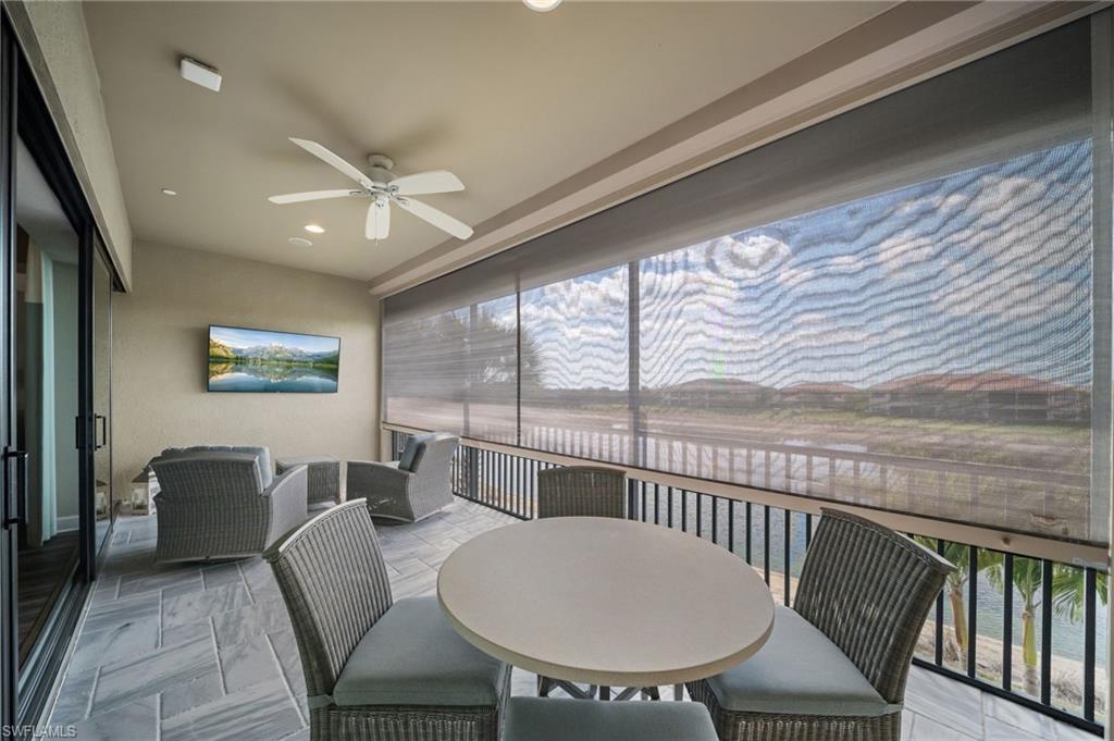 9672 Montelanico Loop, Unit 203 Naples, FL 34119 - Photo 27 of 49 a view of a dining room with furniture window and outside view