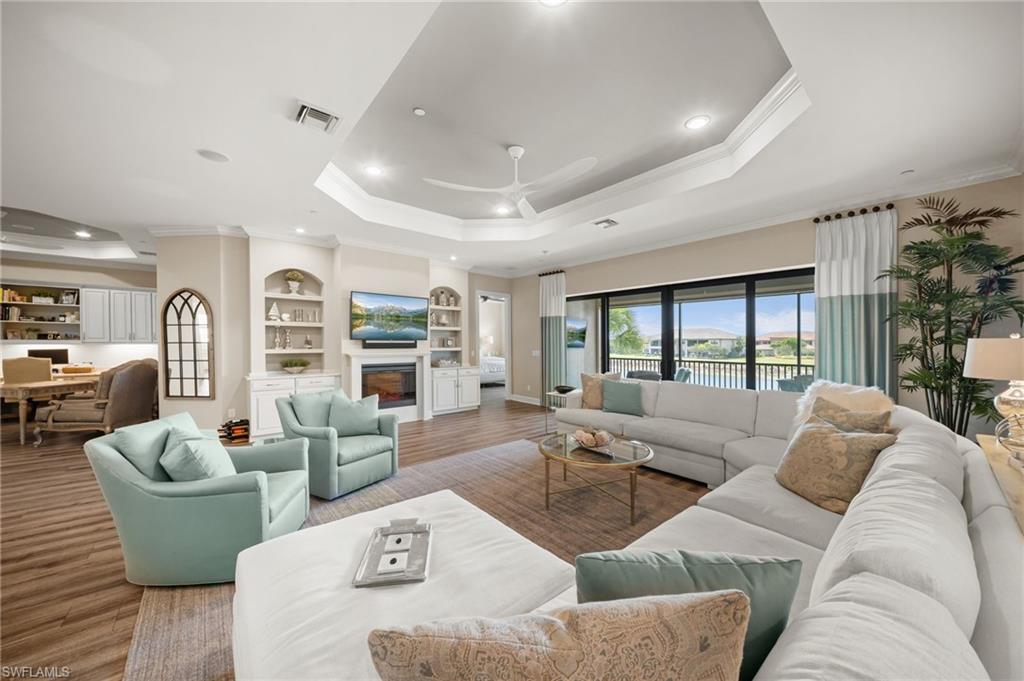 9672 Montelanico Loop, Unit 203 Naples, FL 34119 - Photo 6 of 49 a living room with furniture and a large window