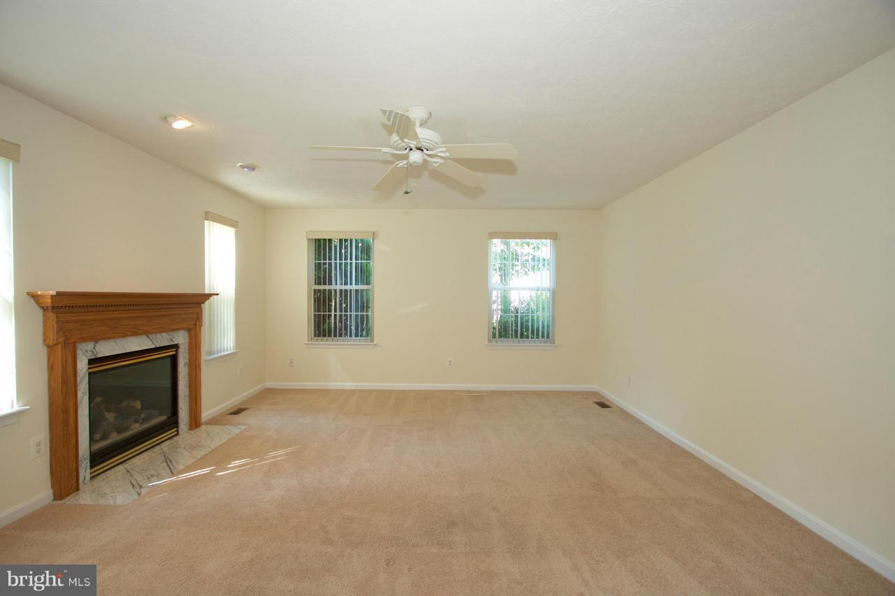 490 Copeland Road Fallston, MD 21047 - Photo 14 of 29 an empty room with windows and fireplace