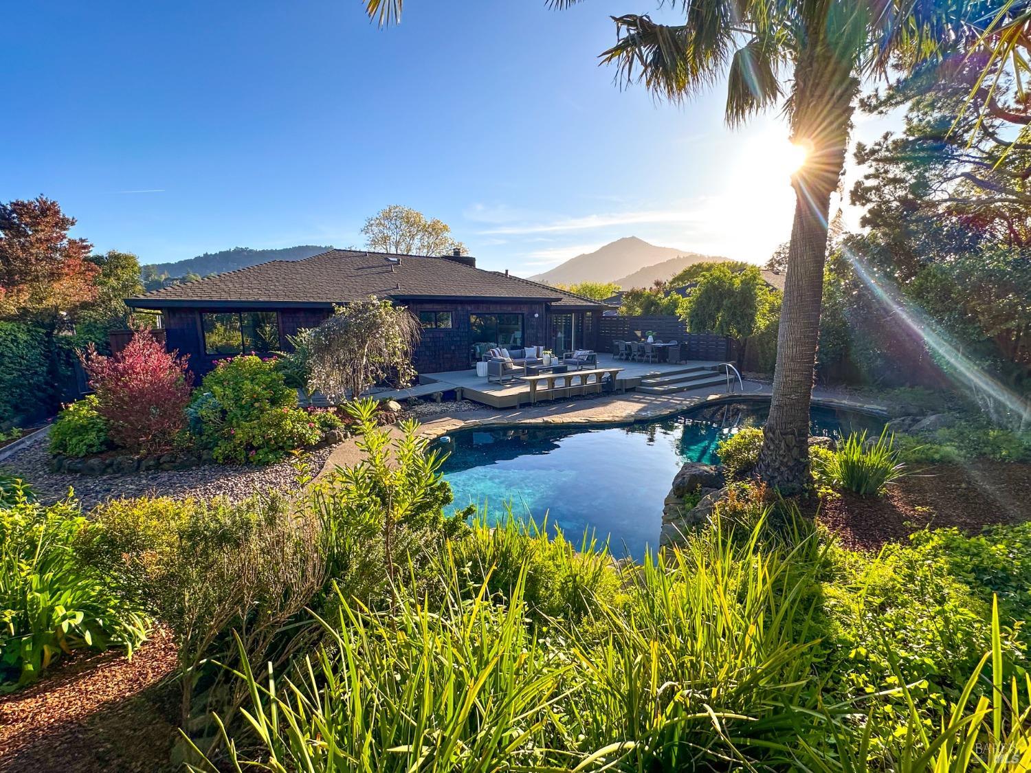 679 Riviera Circle Larkspur, CA 94939 - Photo 1 of 1 a view of a lake with a building in the background