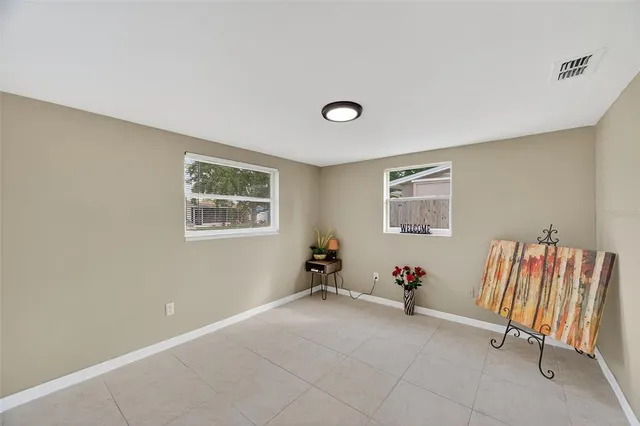 an empty room with a fan