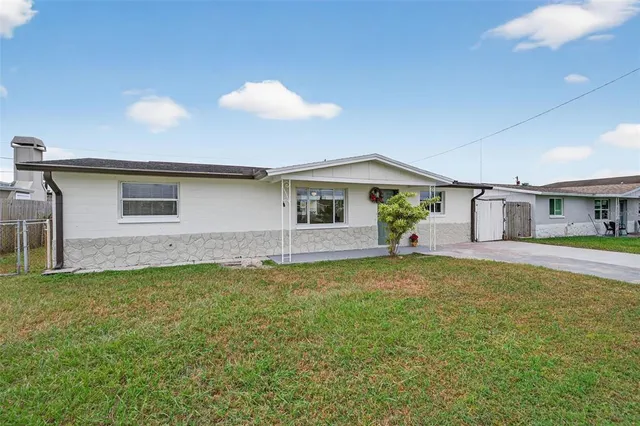an empty room with furniture and a window