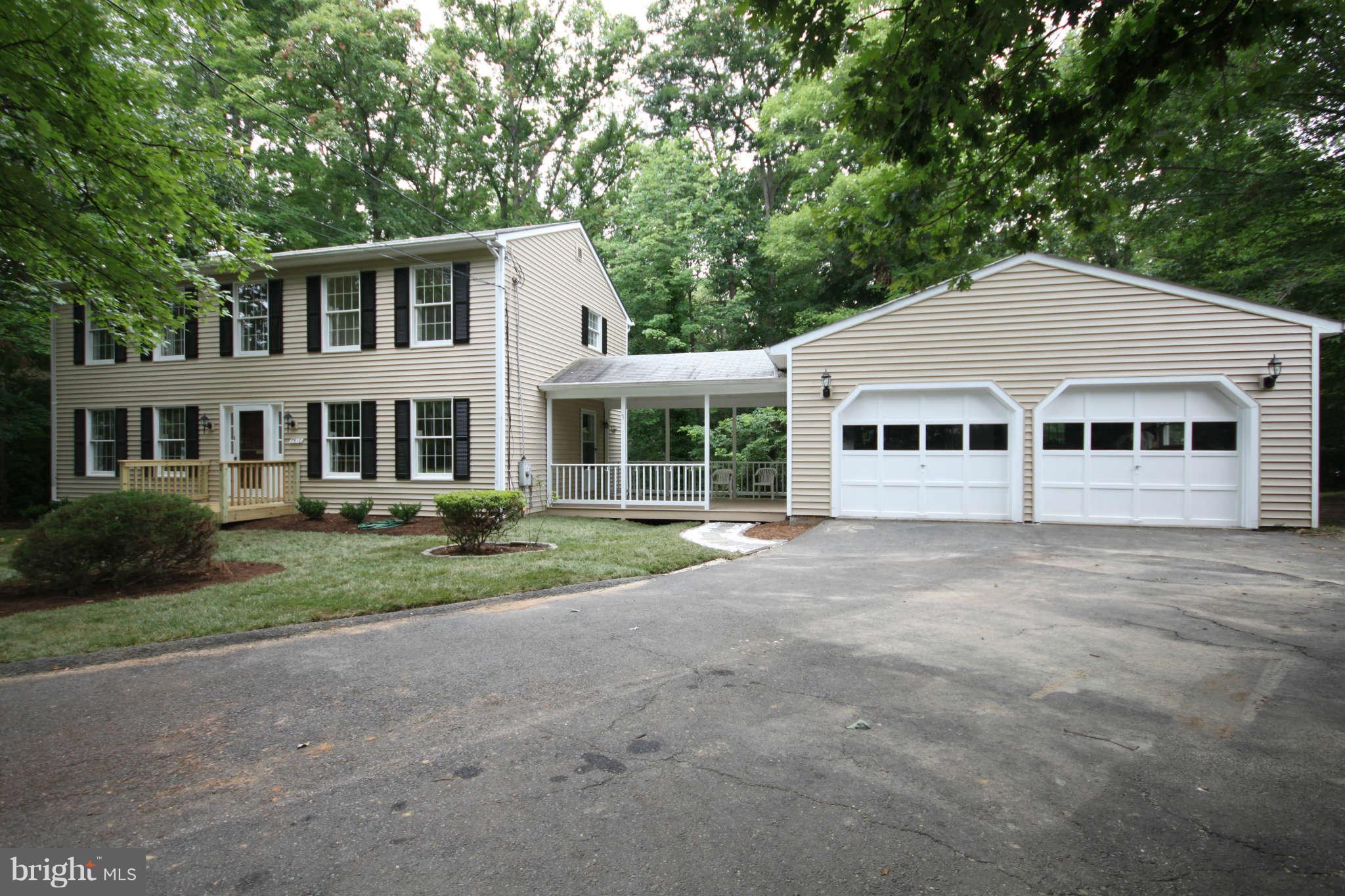 7510 Gambrill Road Springfield, VA 22153 - Photo 1 of 30 a front view of a house with a garden