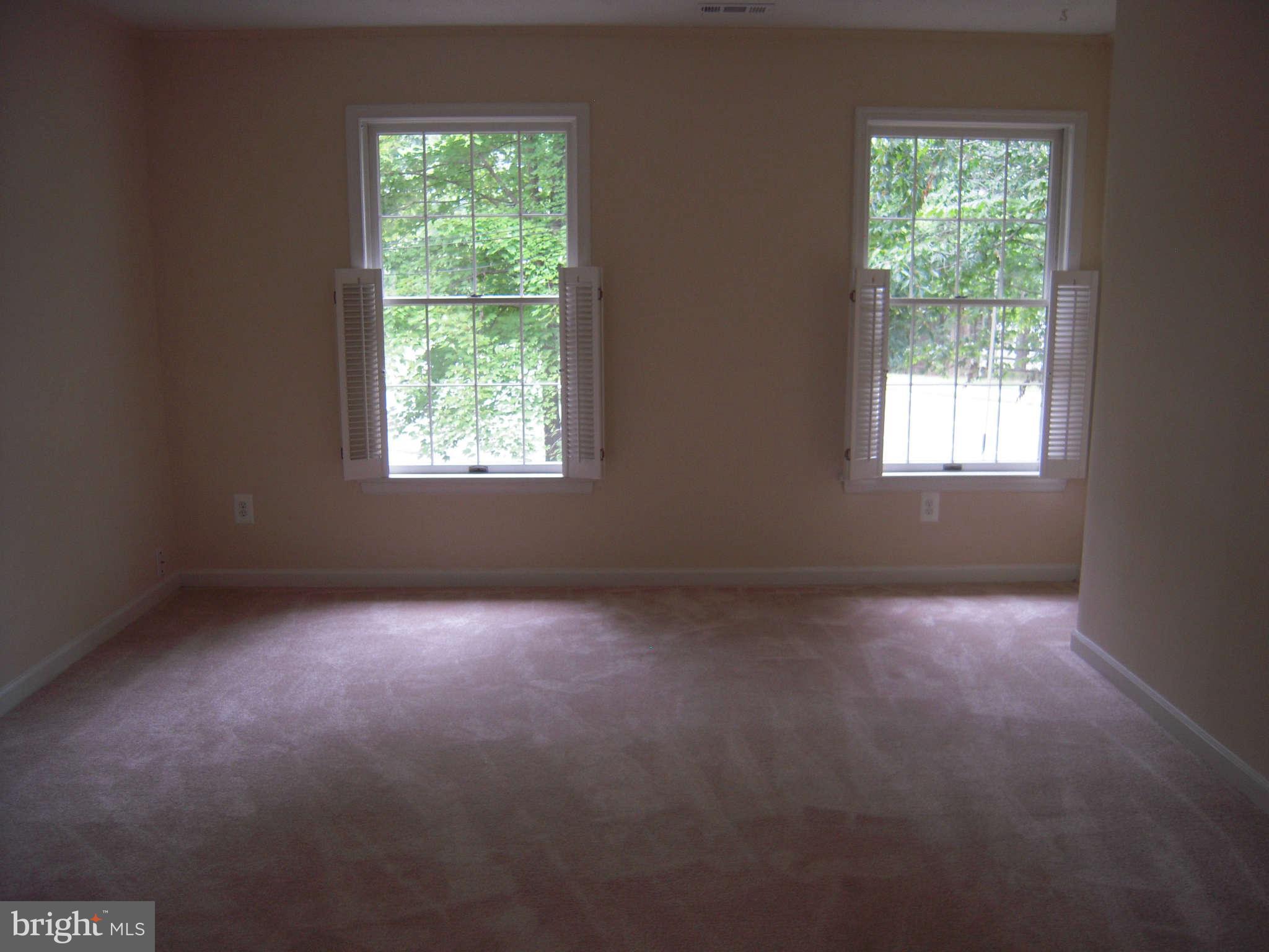 7510 Gambrill Road Springfield, VA 22153 - Photo 16 of 30 a view of a big room with windows and chandelier fan