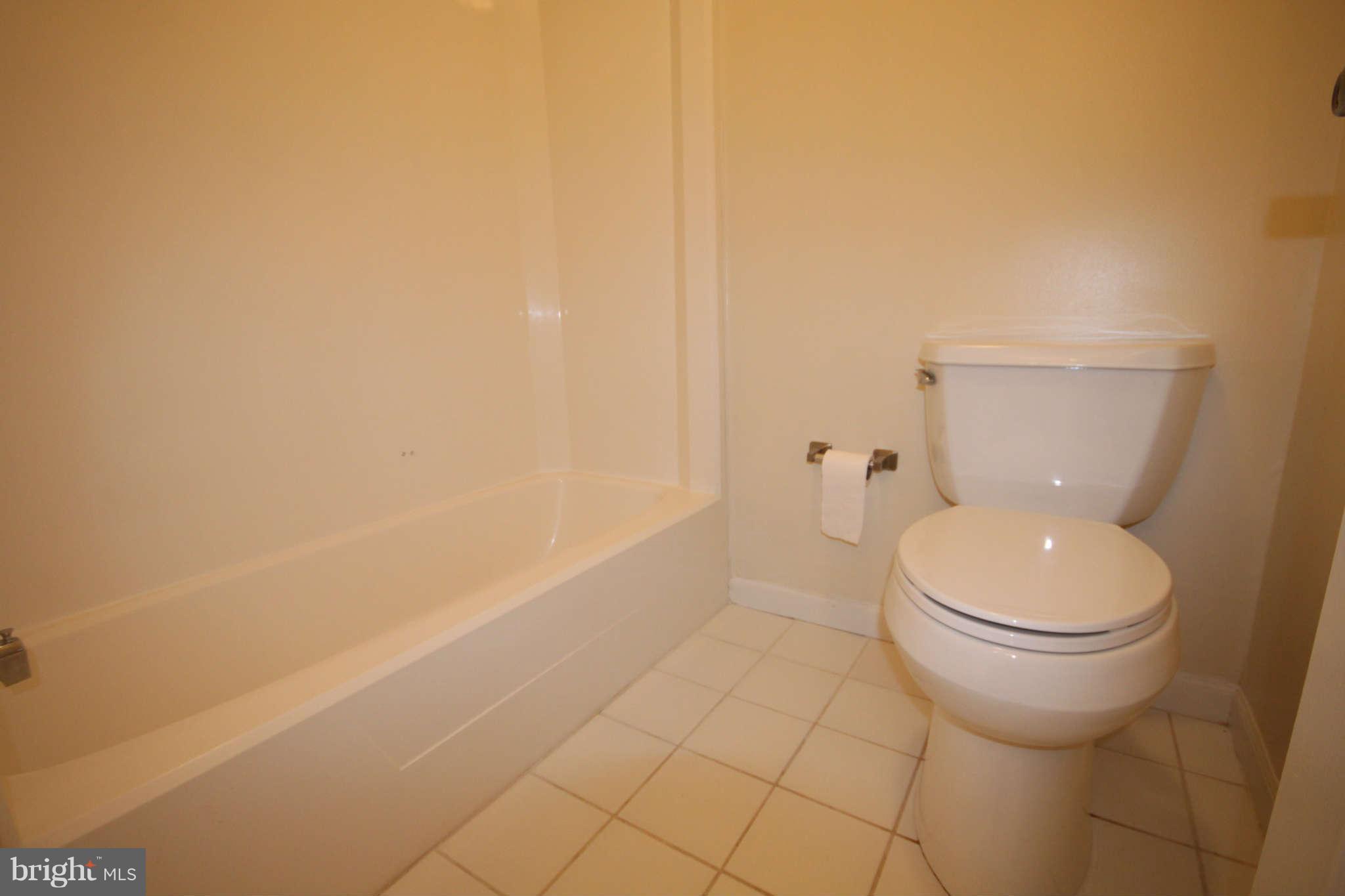 7510 Gambrill Road Springfield, VA 22153 - Photo 18 of 30 a bathroom with a toilet and a shower