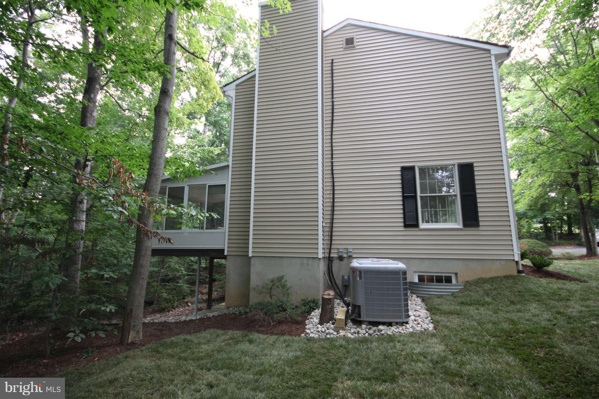 7510 Gambrill Road Springfield, VA 22153 - Photo 3 of 30 a view of a backyard with plants and large trees