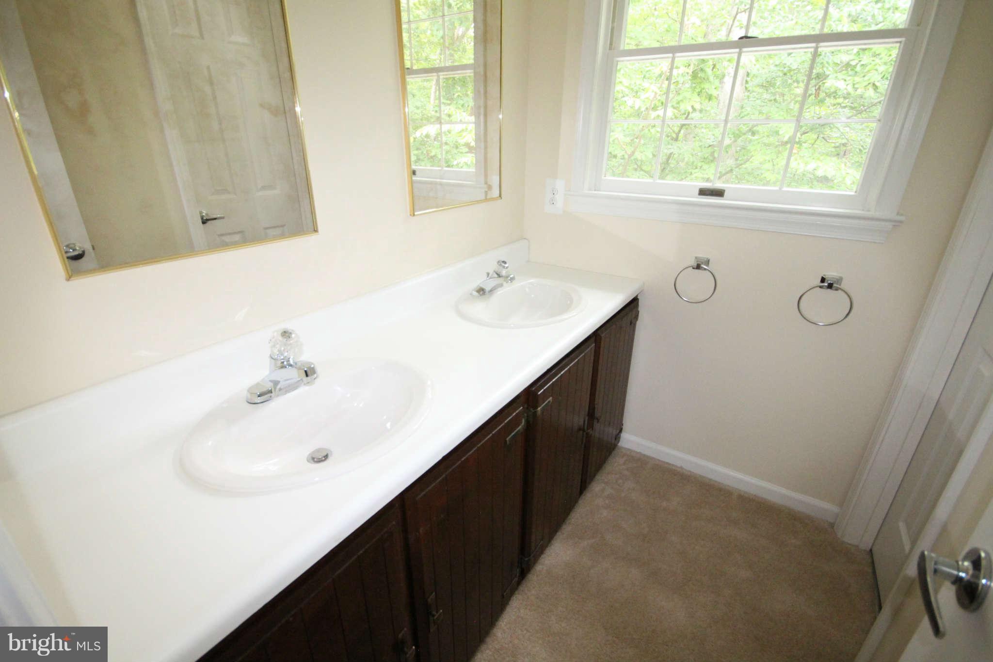 7510 Gambrill Road Springfield, VA 22153 - Photo 25 of 30 a bathroom with a sink and a bathtub