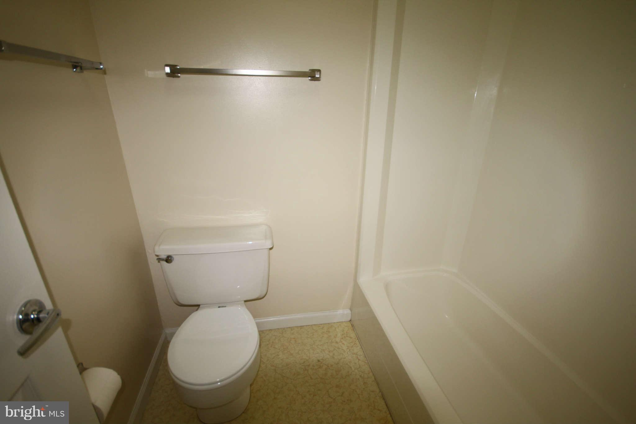 7510 Gambrill Road Springfield, VA 22153 - Photo 26 of 30 a bathroom with a toilet and a shower