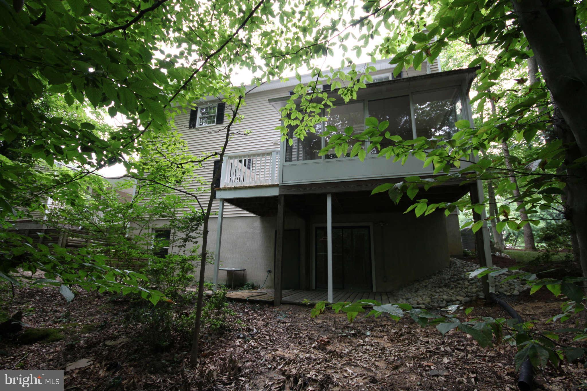 7510 Gambrill Road Springfield, VA 22153 - Photo 4 of 30 a view of a house with a tree