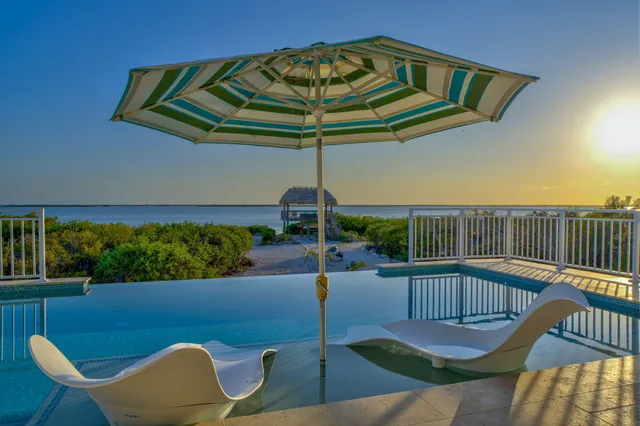 a bedroom with a bed mirror and window