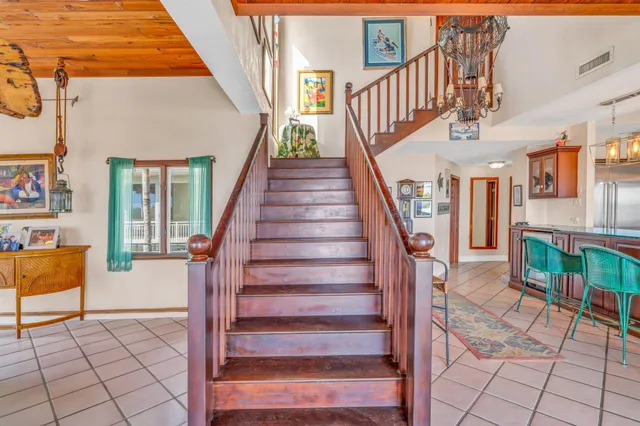 a bathroom with a toilet sink vanity and mirror