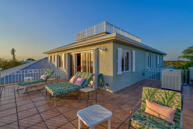 a view of a patio with a table chairs and a table