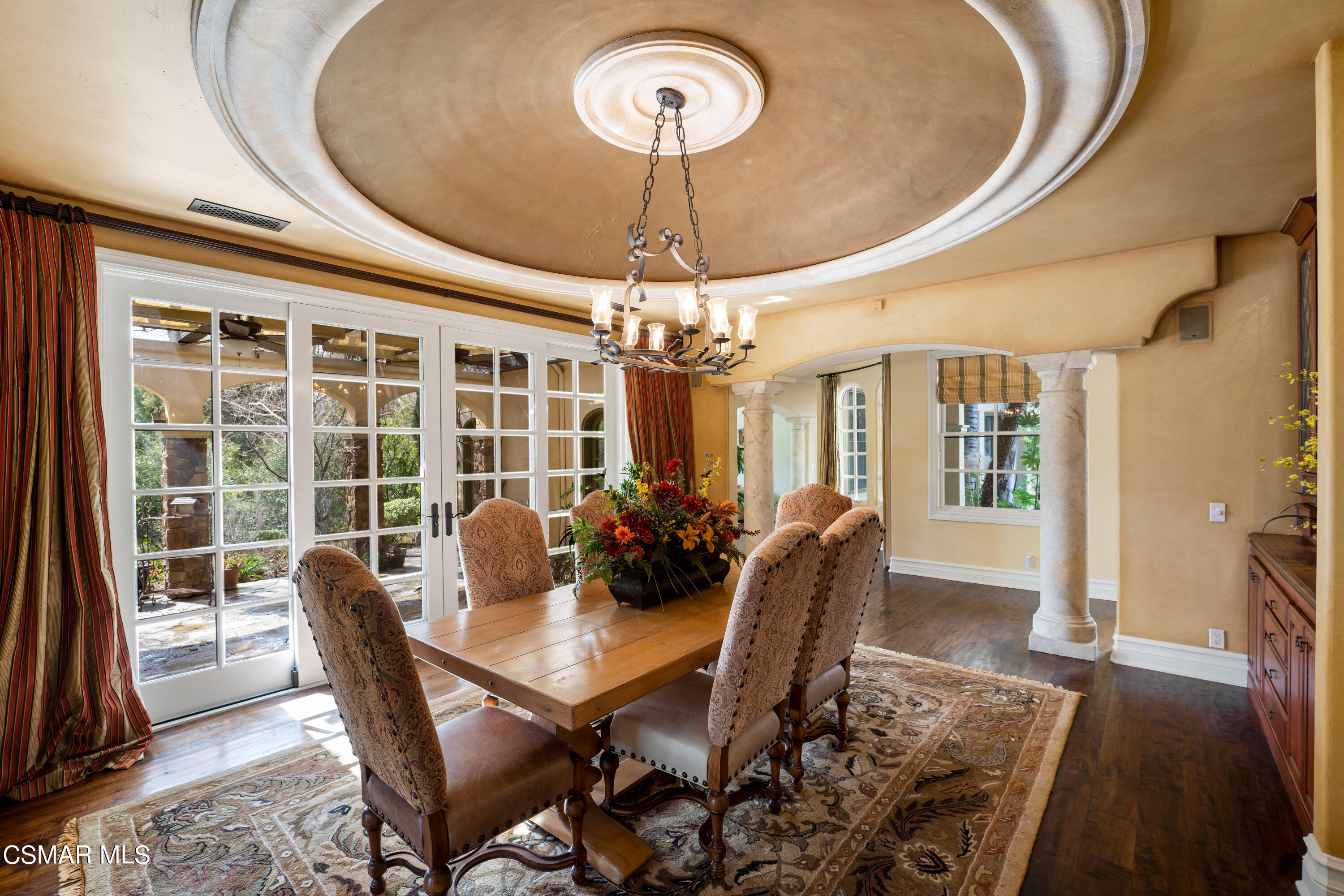 28685 Wagon Road Agoura Hills, CA 91301 - Photo 12 of 43 a dining room with furniture a chandelier and window