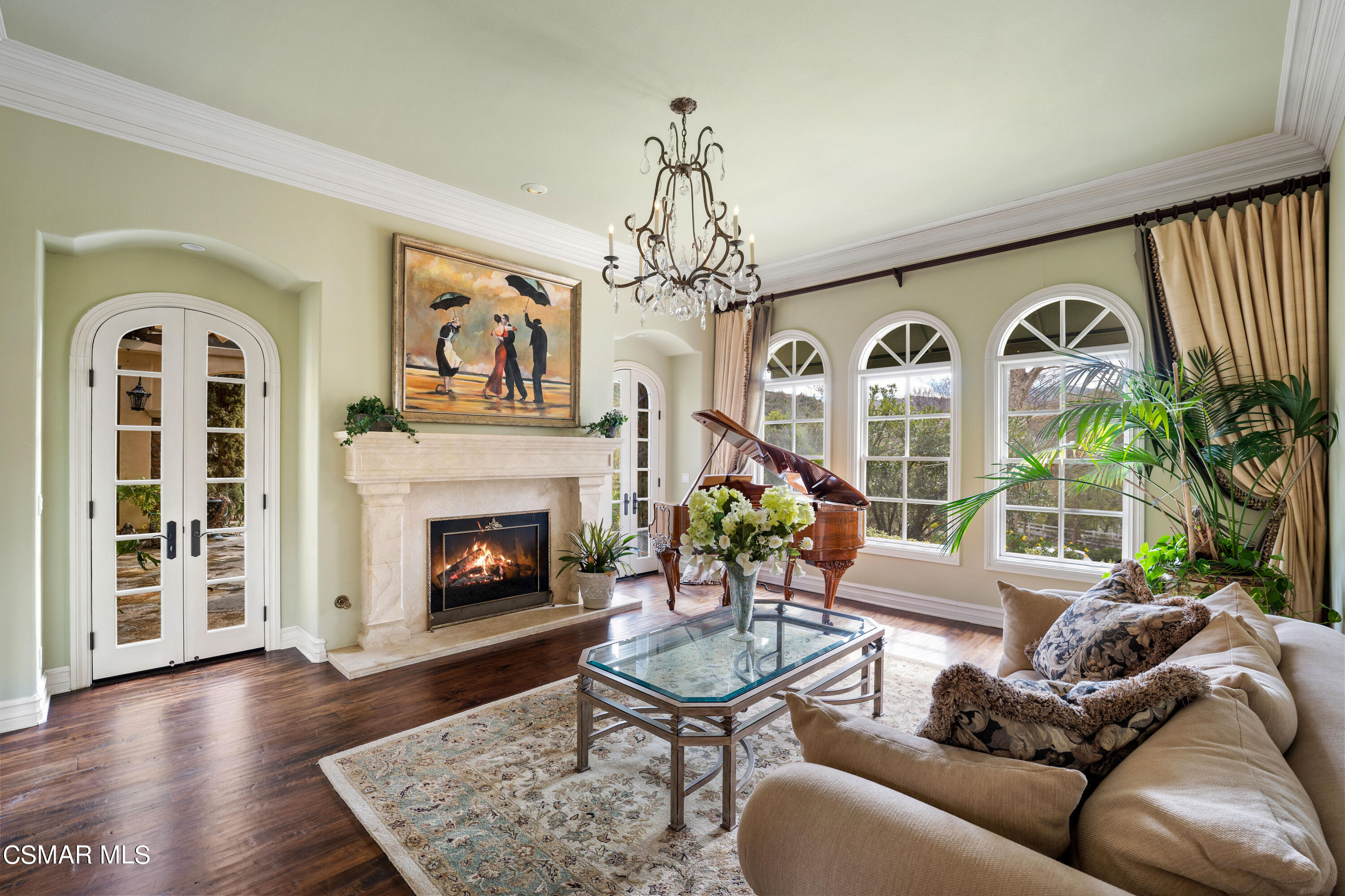 28685 Wagon Road Agoura Hills, CA 91301 - Photo 14 of 43 a living room with furniture a fireplace and a large window