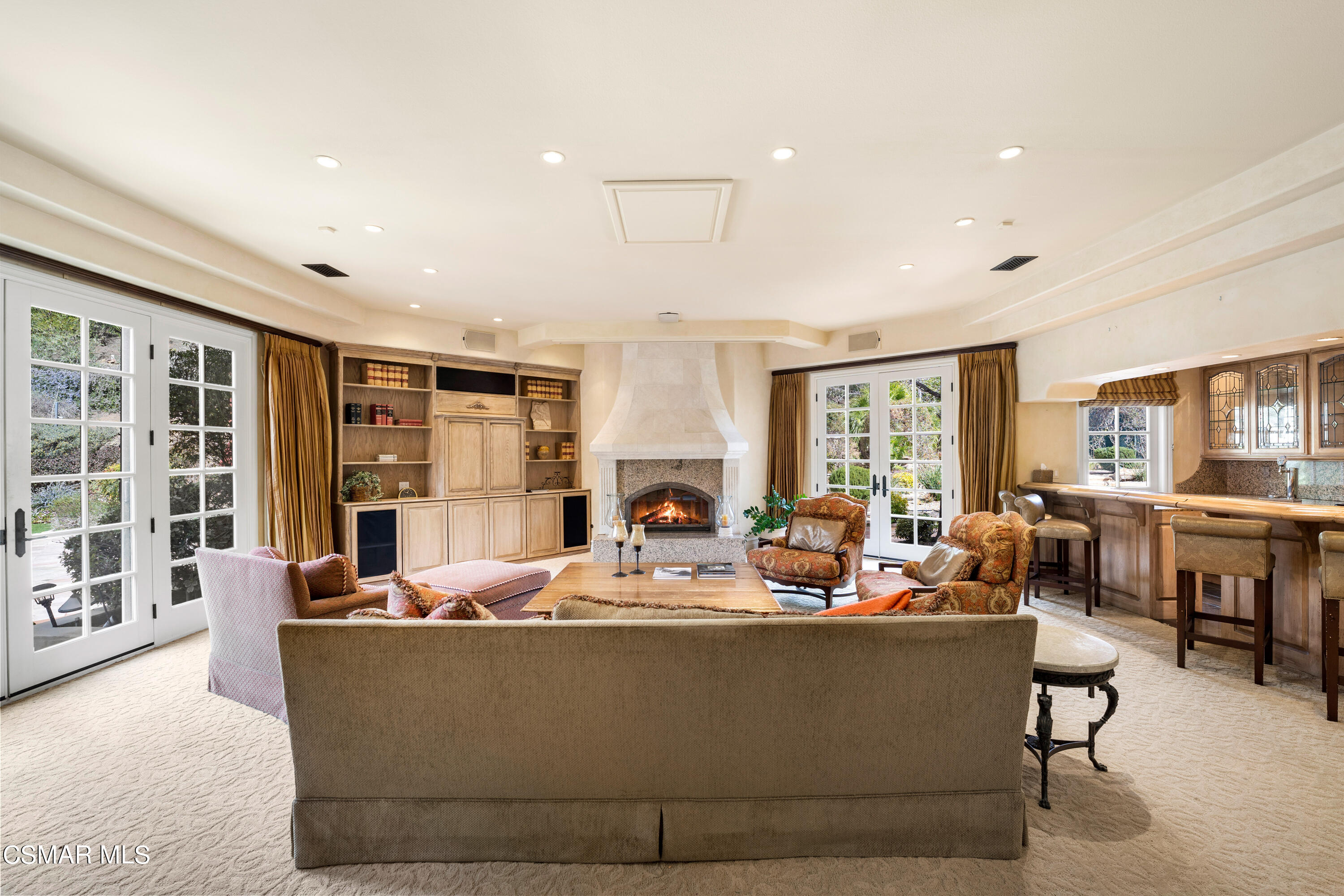 28685 Wagon Road Agoura Hills, CA 91301 - Photo 17 of 43 a living room with fireplace furniture and a large window