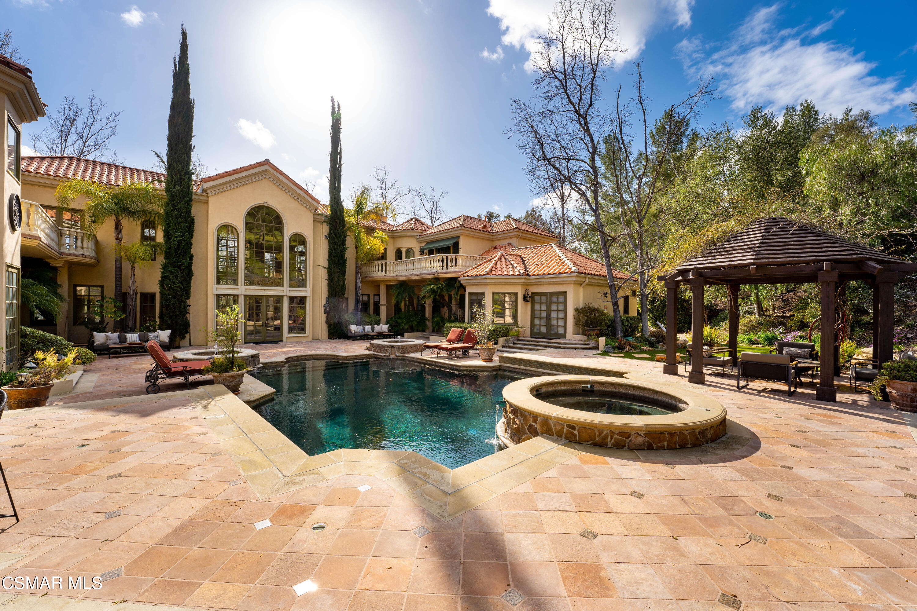 28685 Wagon Road Agoura Hills, CA 91301 - Photo 32 of 43 a view of a patio with swimming pool table and chairs