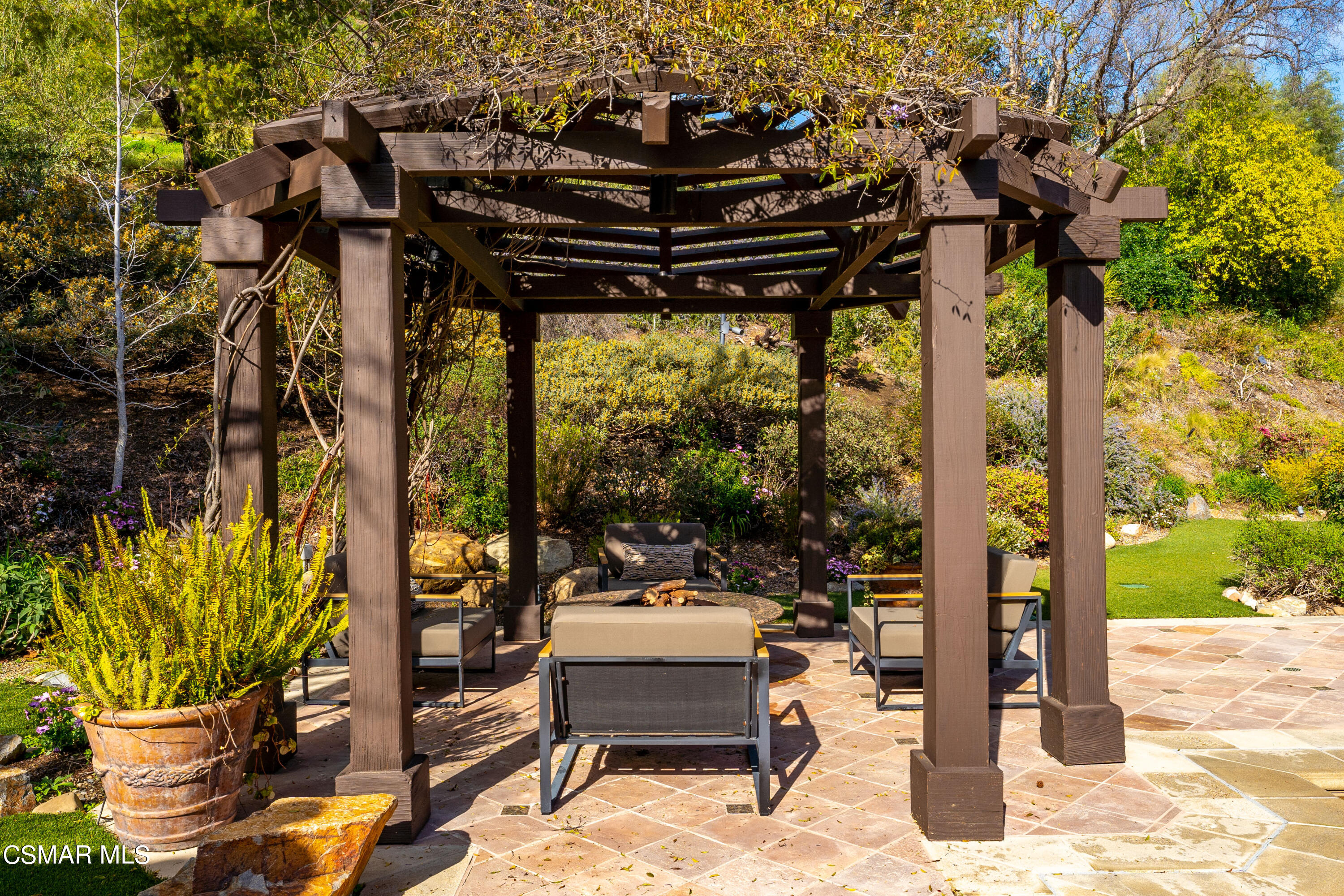 28685 Wagon Road Agoura Hills, CA 91301 - Photo 35 of 43 a patio with table and chairs and potted plants