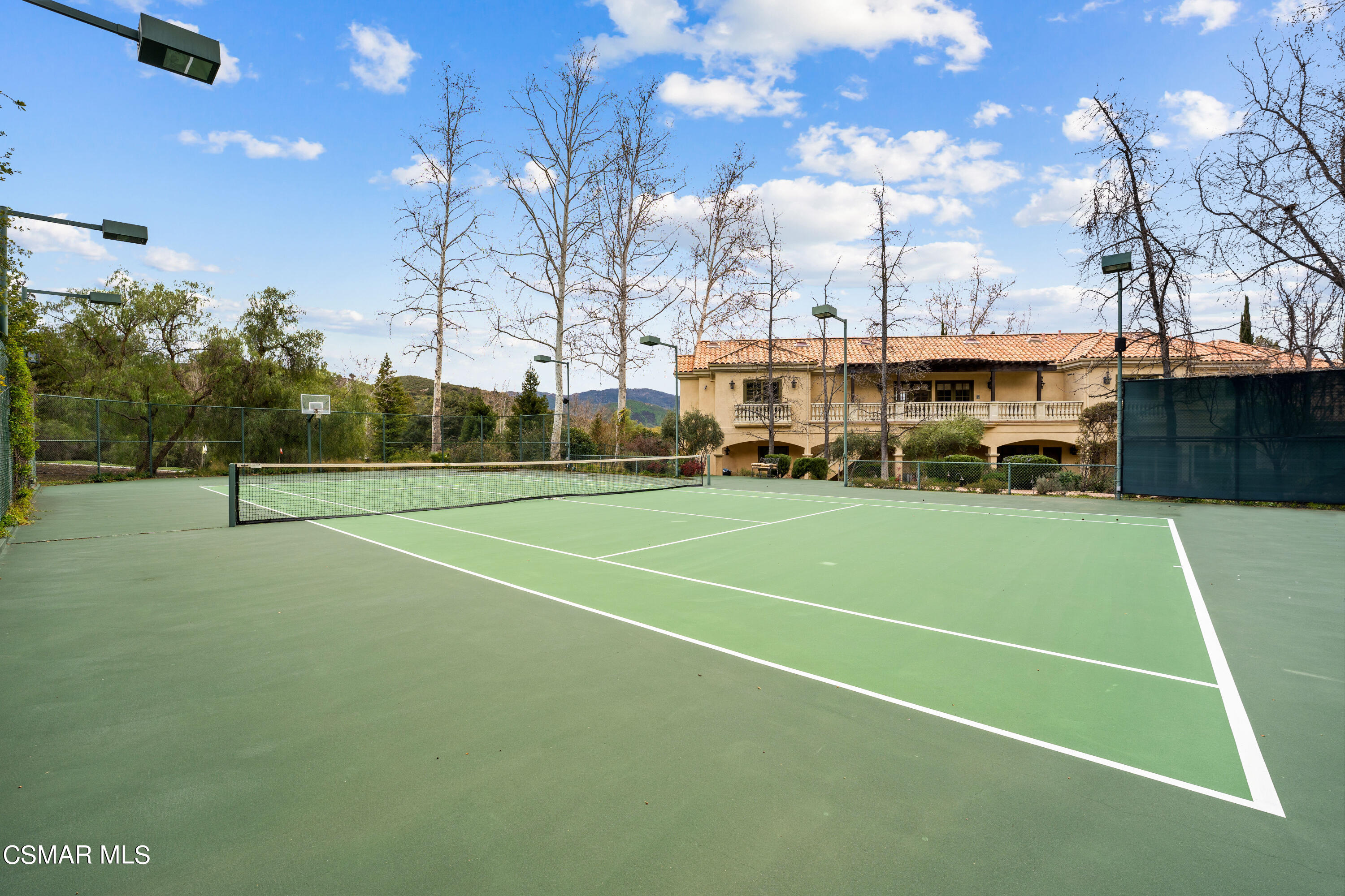 28685 Wagon Road Agoura Hills, CA 91301 - Photo 40 of 43 a view of a tennis ground with large trees