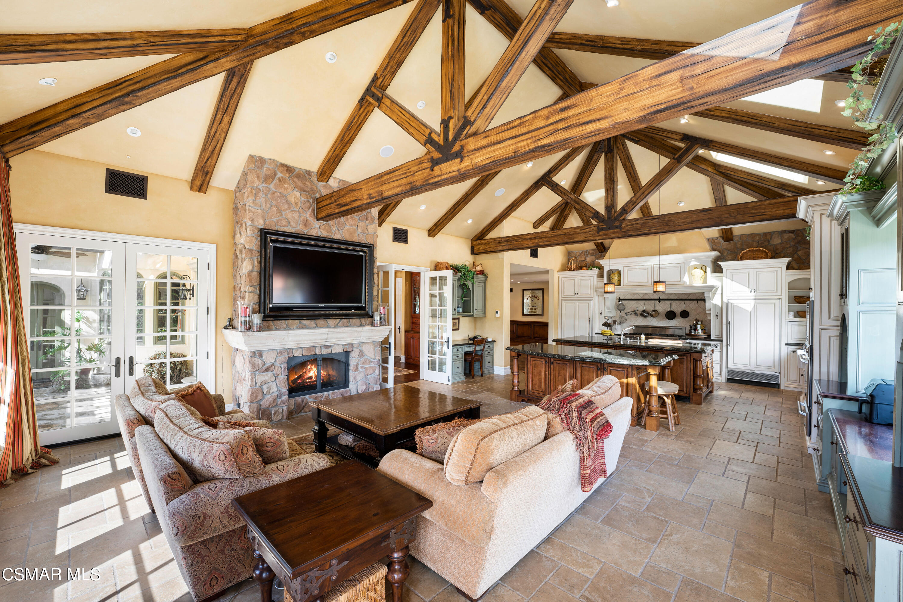 28685 Wagon Road Agoura Hills, CA 91301 - Photo 10 of 43 a living room with furniture and a flat screen tv
