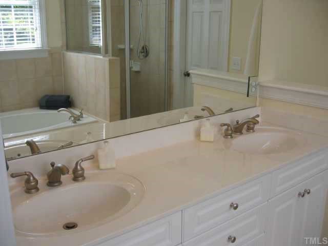 820 Running Brook Trail Raleigh, NC 27609 - Photo 4 of 10 Master bathroom has dual vanities, whirlpool tub, separate shower and walk-in closet.