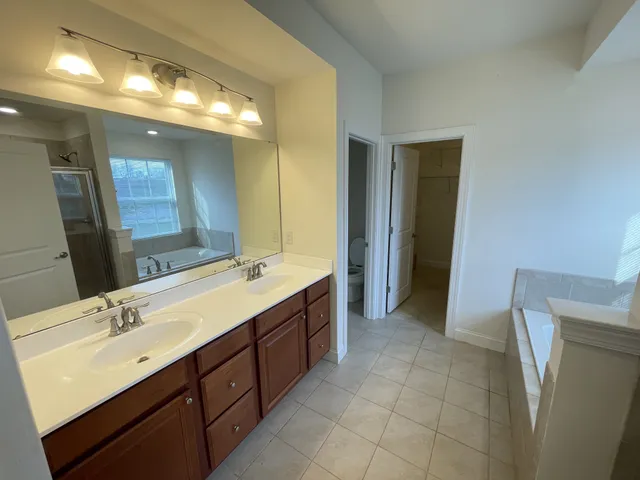 a bathroom with a tub and shower