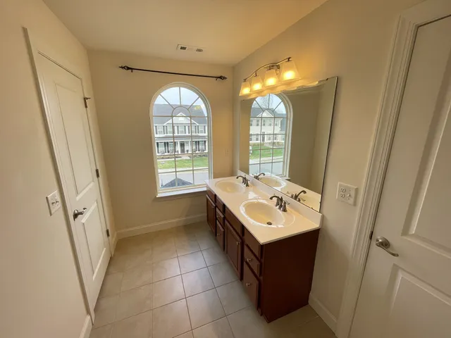 a bathroom with a tub and a shower