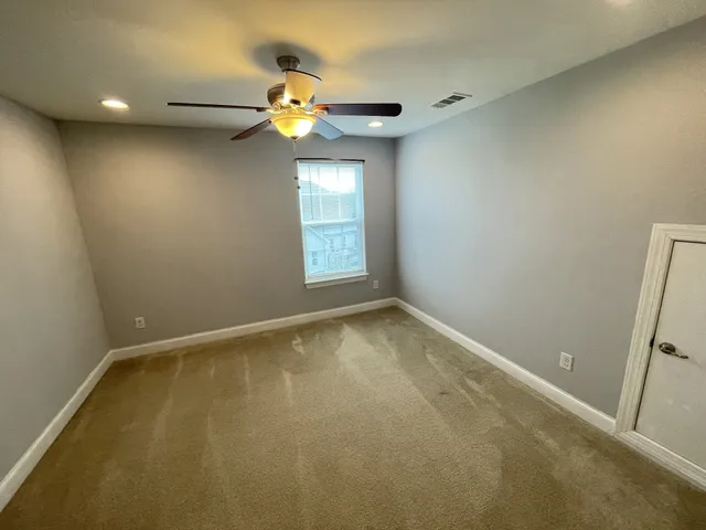 a view of a hallway with a window
