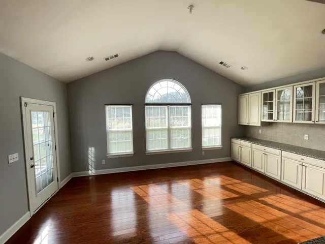 a kitchen with stainless steel appliances granite countertop a stove a sink and a granite counter tops