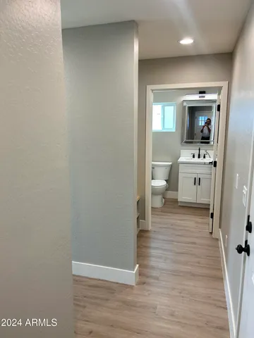 a kitchen with a refrigerator and a stove