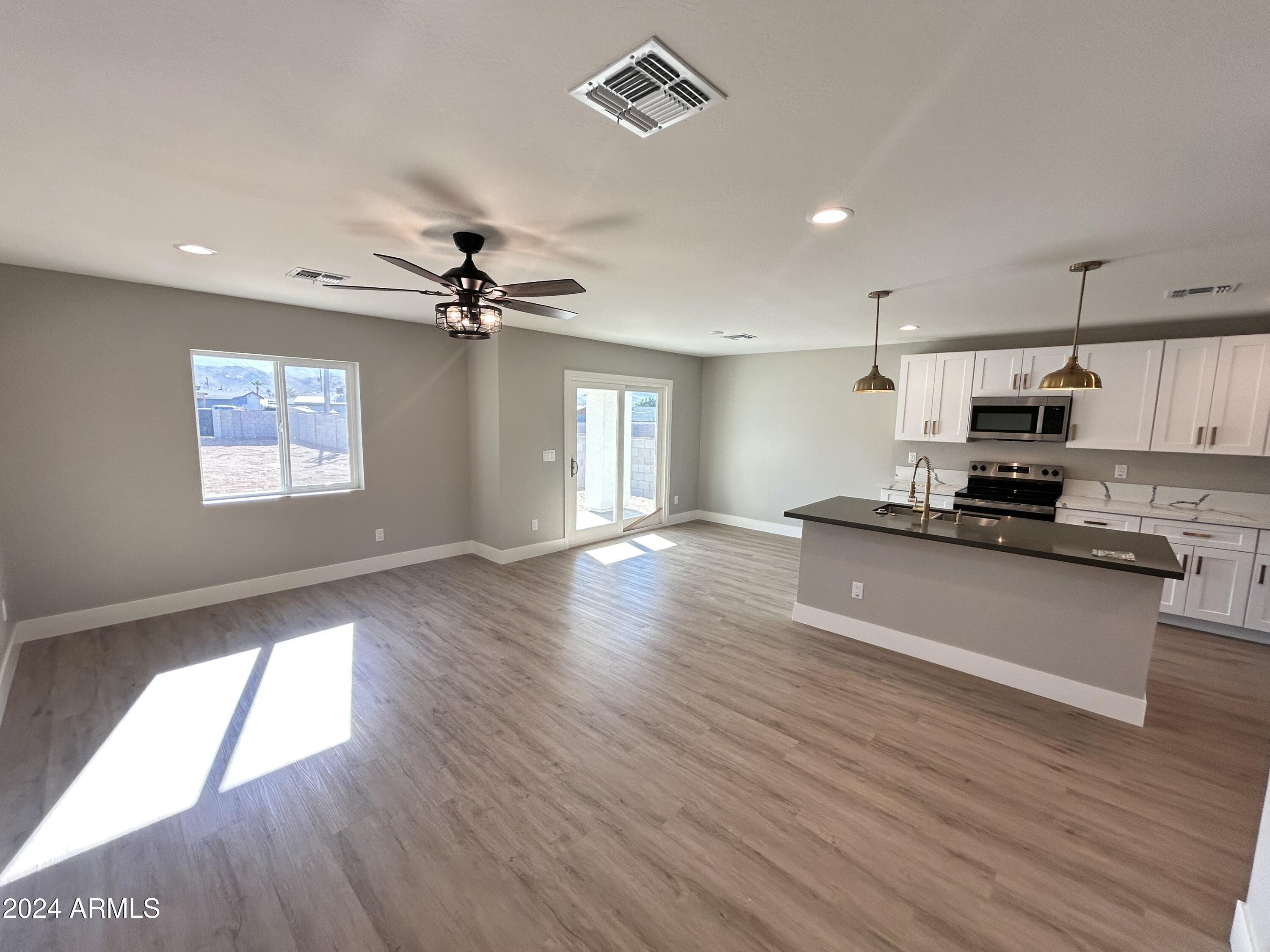 825 West Dobbins Road Phoenix, AZ 85041 - Photo 20 of 99 a view of kitchen with sink and wooden floor