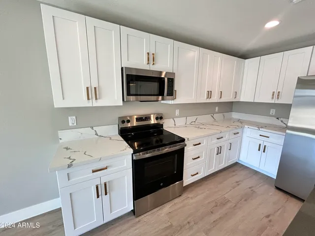 a bathroom with a double vanity sink and mirror