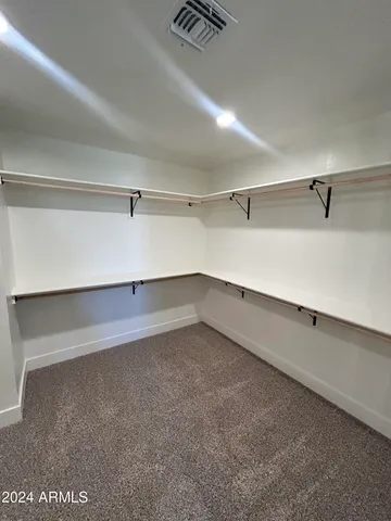 a kitchen with stainless steel appliances a refrigerator and a stove top oven