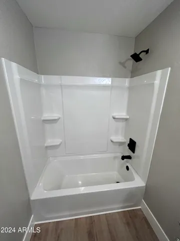 a bathroom with a sink a mirror and vanity