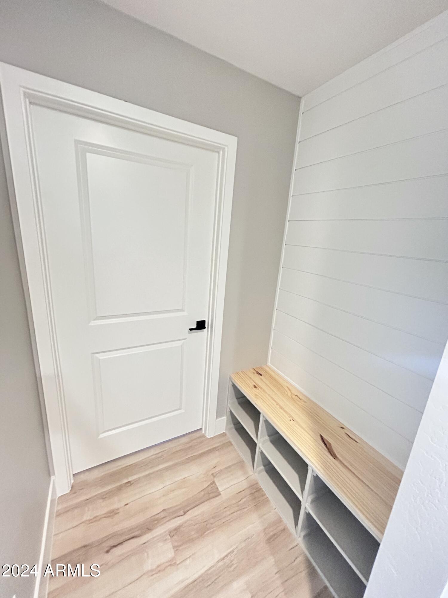 825 West Dobbins Road Phoenix, AZ 85041 - Photo 59 of 99 a view of room with hardwood floor and cabinet