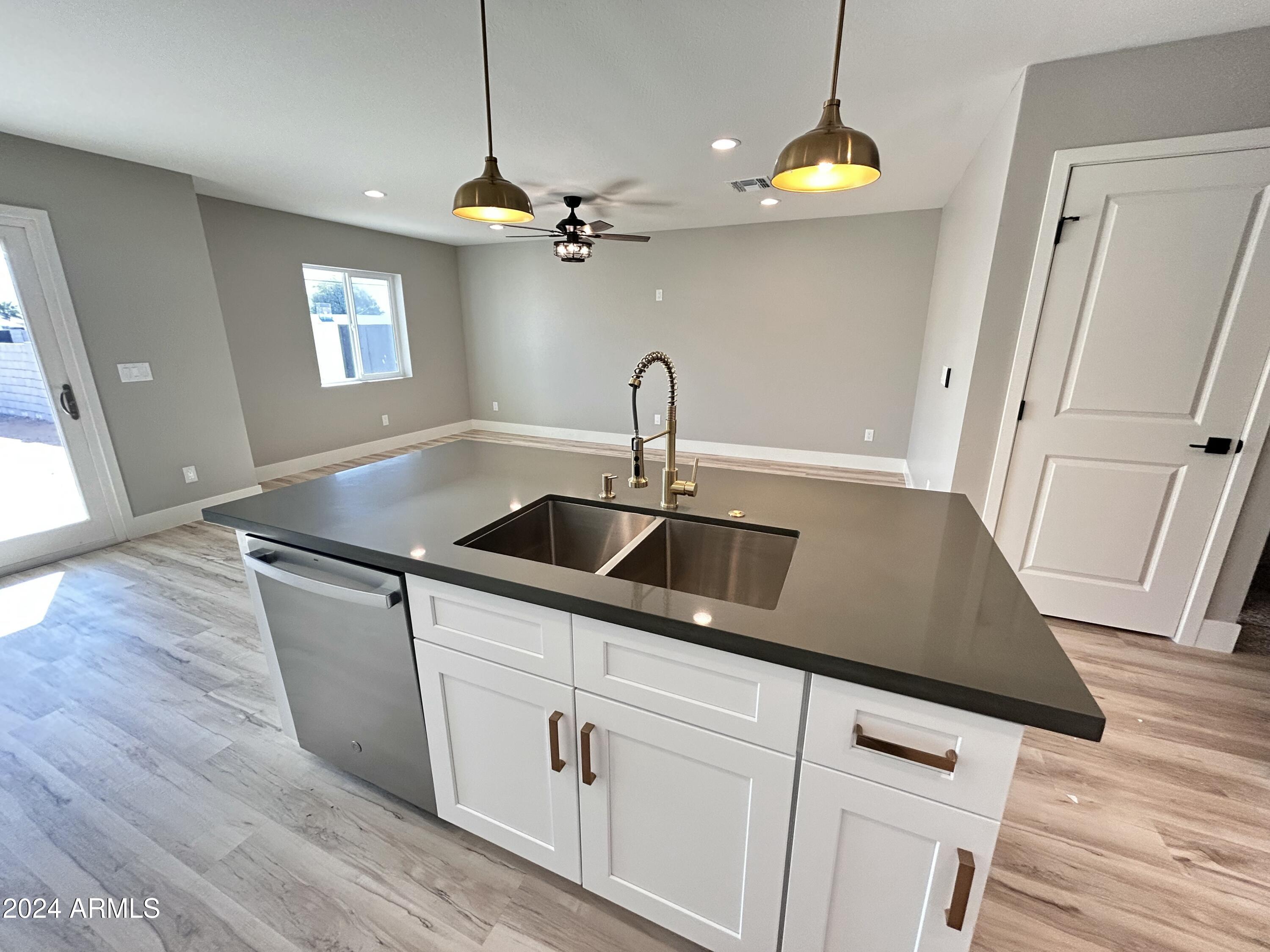 825 West Dobbins Road Phoenix, AZ 85041 - Photo 66 of 99 a kitchen with sink and window