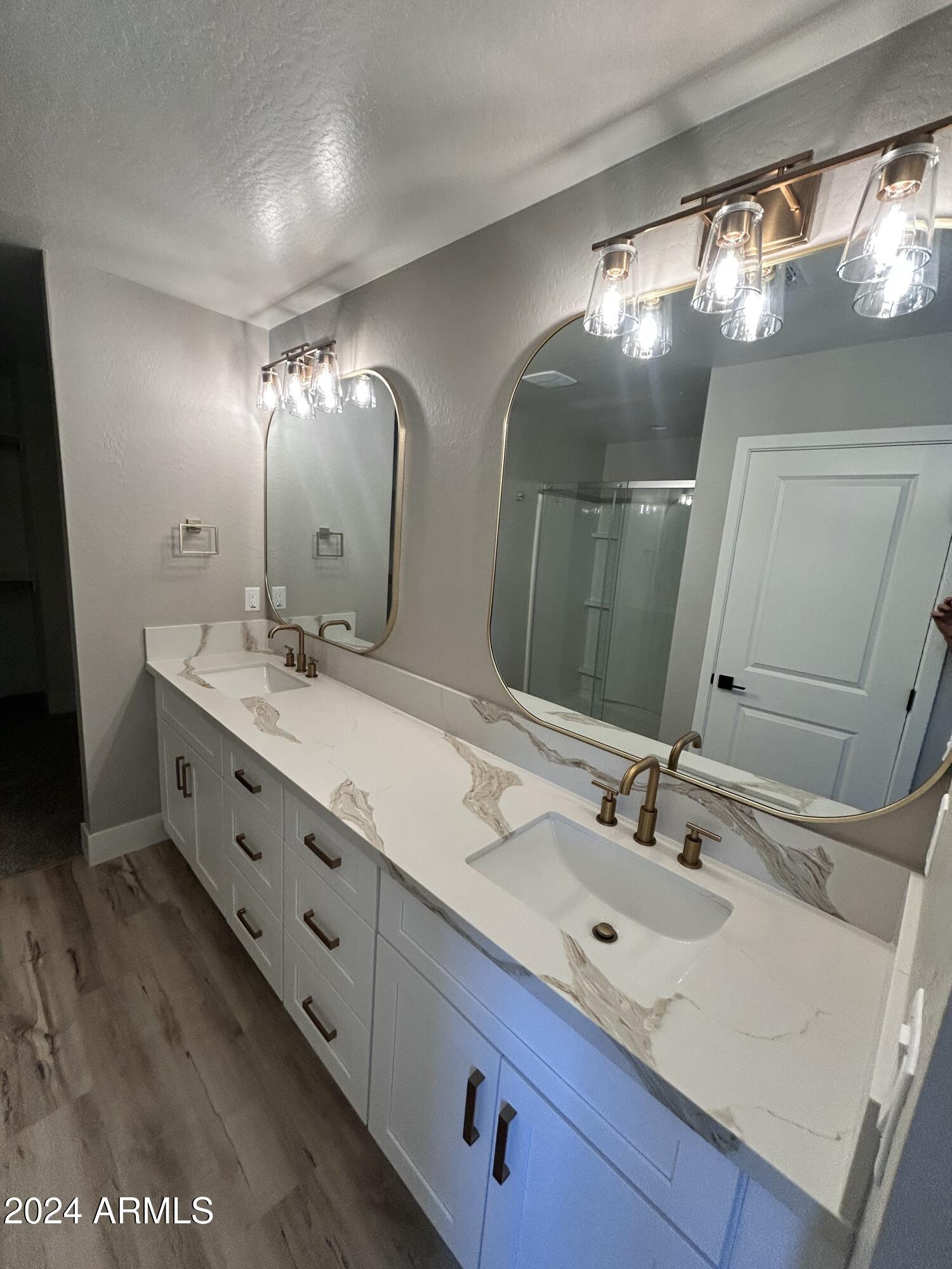 825 West Dobbins Road Phoenix, AZ 85041 - Photo 85 of 99 a bathroom with double vanity and a mirror