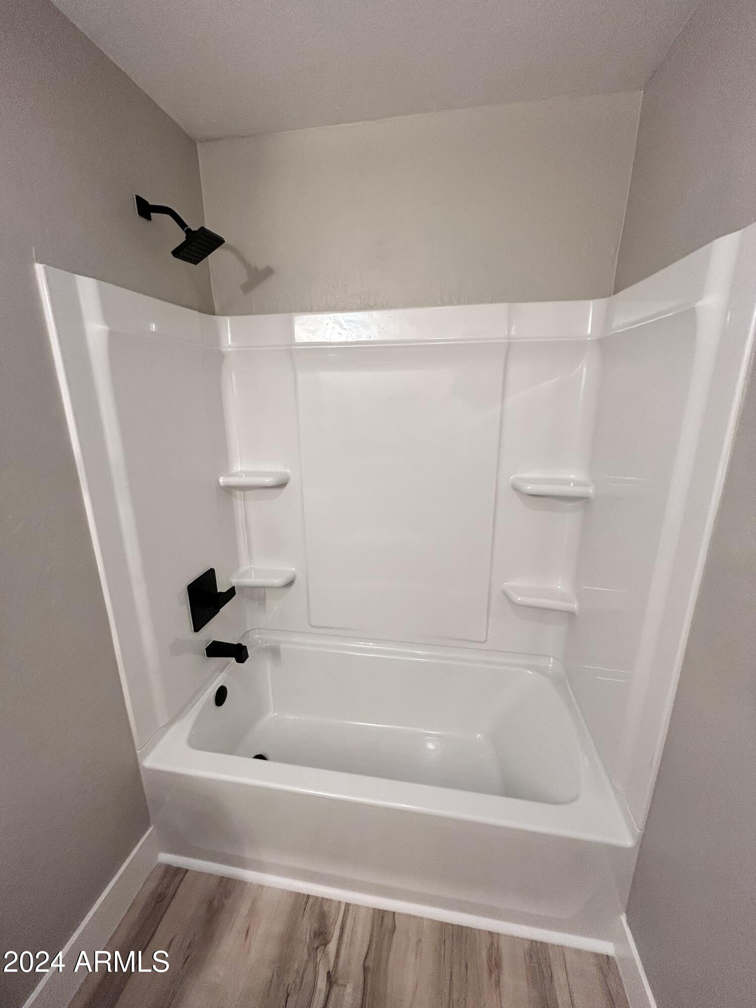 825 West Dobbins Road Phoenix, AZ 85041 - Photo 93 of 99 a bathroom with a bathtub and shower