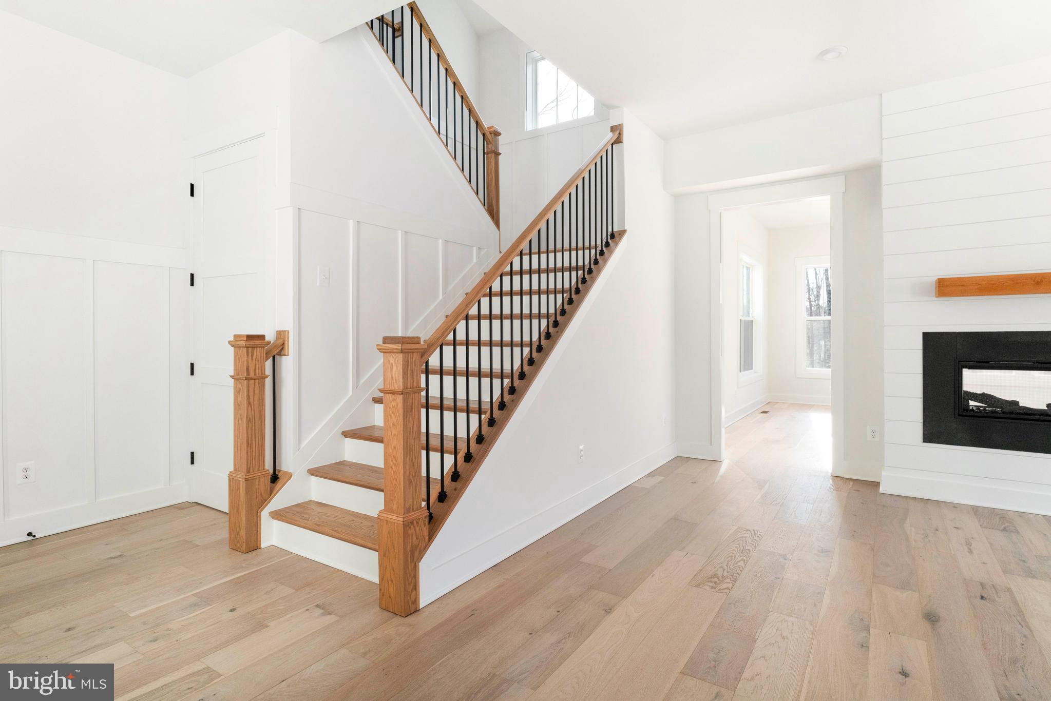 3321 Patuxent River Road Davidsonville, MD 21035 - Photo 15 of 81 a view of a hallway with wooden floor and staircase
