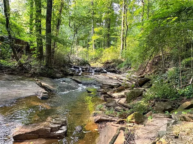 a view of swimming pool with a yard