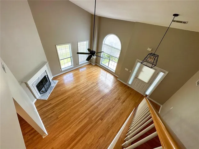 a view of an entryway with wooden floor