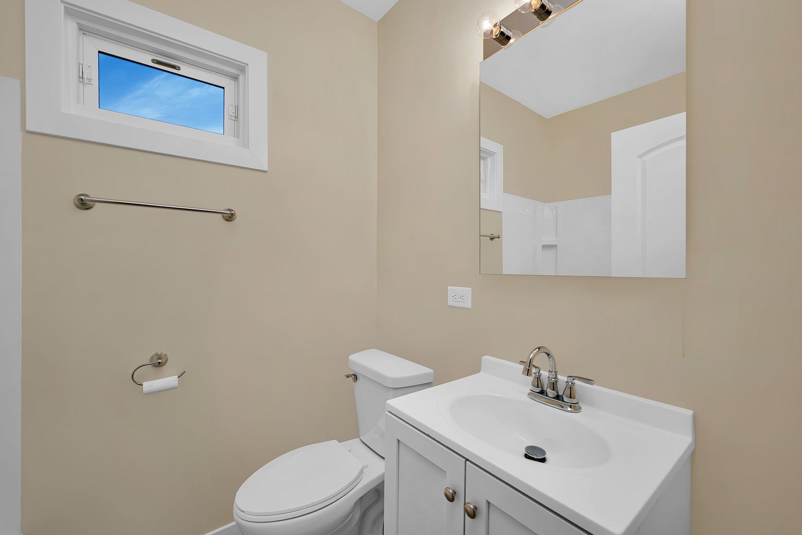 729 Claim Street Aurora, IL 60505 - Photo 11 of 34 a bathroom with a sink mirror and toilet