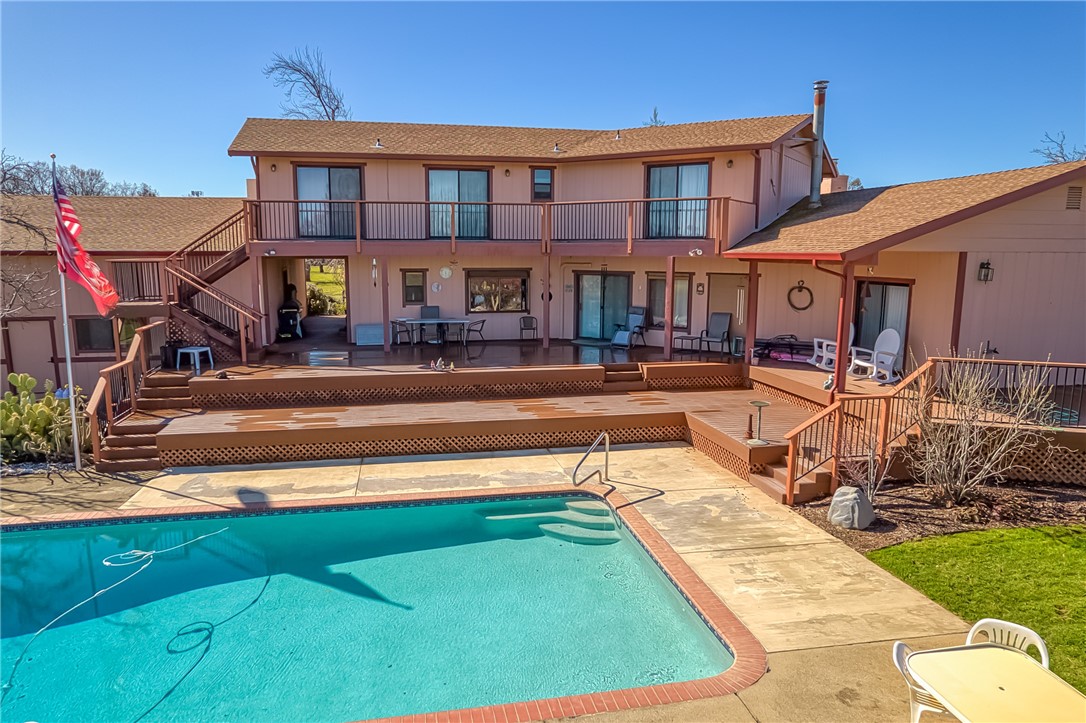 6535 Highland Springs Road Lakeport, CA 95453 - Photo 33 of 75 a view of a big yard with table and chairs in patio